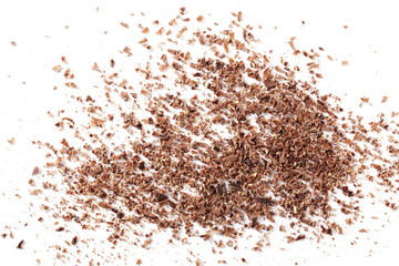 Pile chopped, milled chocolate with hazelnut isolated on white background, top view