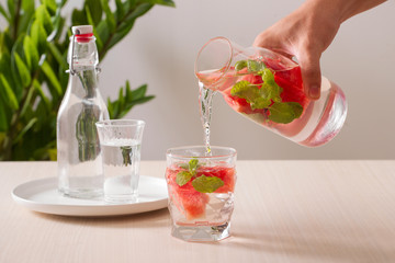 Watermelon infused water on white background