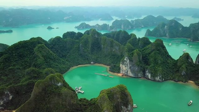 Helicopter tropical Ha Long Bay lot sharp natural rocks sea blue azure water. Wild natural untouched seascape horizon. Famous popular travel sight. Best Asia Vietnam. Drone