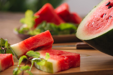 Sliced watermelon on the wood background