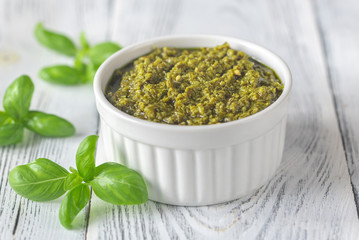 Bowl of pesto on the wooden table