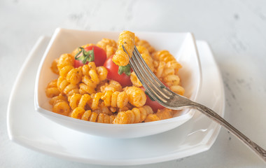 Portion of pasta with tomato and ricotta pesto
