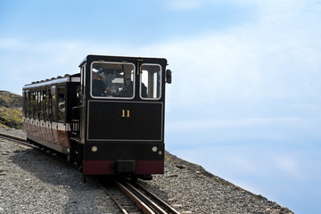 Mountain train against blue sky