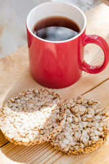 Red coffee cup on wooden desk