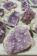 Inside of amathyst quartz geode. aquamarine natural quartz blue gem geological crystals texture background. vertical photo