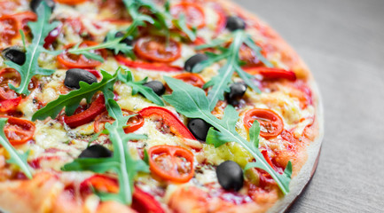 Pizza Margherita or Margarita with Mozzarella cheese, tomato, olive. Italian pizza on wooden background