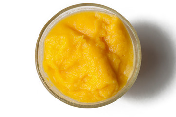 Grinded orange in bowl isolated on a white background.Fruit
