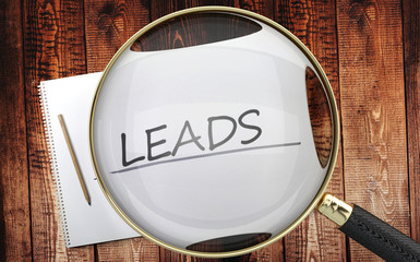 Study, learn and explore leads - pictured as a magnifying glass enlarging word leads, symbolizes analyzing, inspecting and researching the meaning of leads, 3d illustration