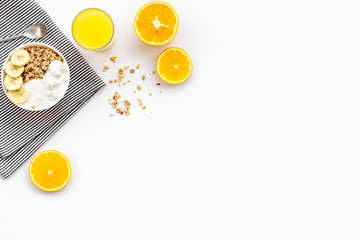 Healthy granola and orange juice for colorful breakfast on white background top view mock-up