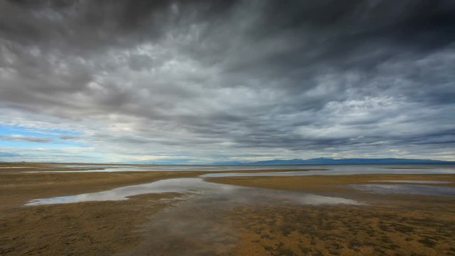 4K. Storm clouds before rain in the salted lake Durgun Nuur, Mongolia. Ultra HD, 4096x2304