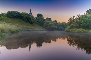 Church on the river at sunrise