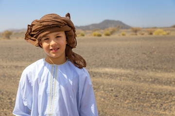 Traditional Arabic boy. Culture heritage in modern world.