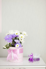 beautiful flowers in vase on white background