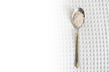 grains of rice in a spoon, white texture