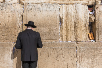 Man praying at the Western wall