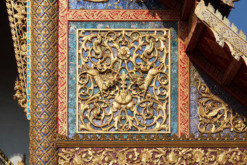 facade (detail) of a pavilion in a buddhist temple (Wat Phra Sing) in chiang mai (thailand)