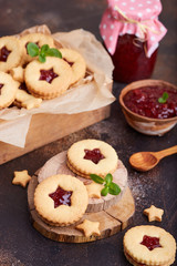 Linzer Christmas cookies with stars. Delicious biscuits with raspberry jam. Sweet dessert.