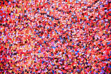 Part mosaic as decorative texture background. Selective focus. Abstract Pattern. Abstract red, blue and black colored ceramic stones