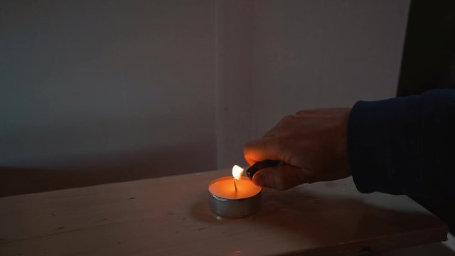 Lighting up a cancle with a lighter