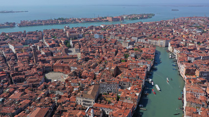 Obraz premium Aerial drone top view photo of iconic and unique colourful Gondolas and boats in Grand Canal near Rialto bridge, Venice, Italy