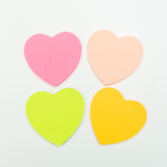  colour  paper heart stick note on a white background