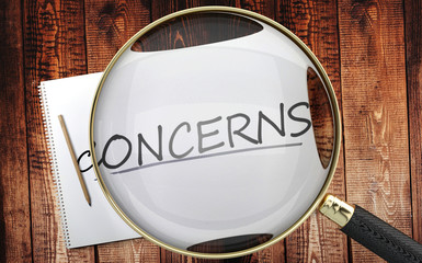 Study, learn and explore concerns - pictured as a magnifying glass enlarging word concerns, symbolizes analyzing, inspecting and researching the meaning of concerns, 3d illustration