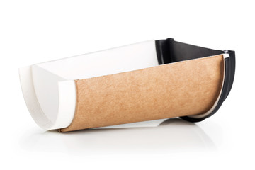 Takeaway coffee in a paper cup. Creative coffee advertising, paper cup in the cut. Advertising coffee.