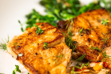 Roasted carp fish with broccoli.