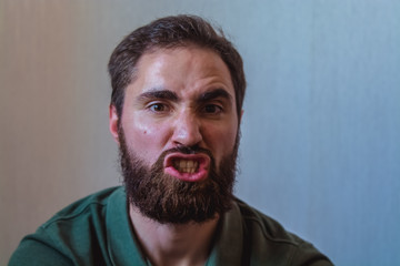 Fototapeta premium Various emotions on a face at the young bearded European man. Different mood.