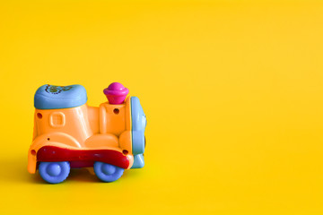 Toy train isolated on a yellow background.