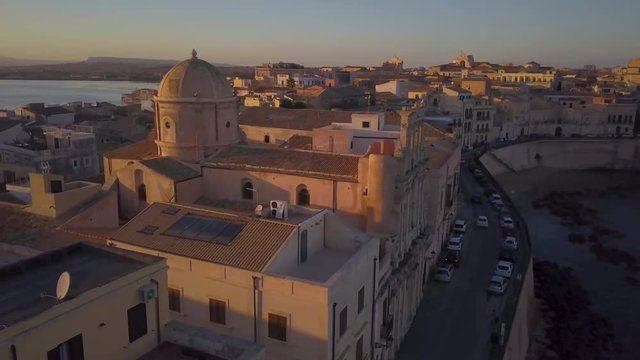 25P wider sunset orbiting counter clockwise around Ortygia church