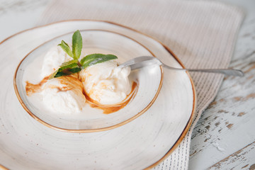 Organic ice cream homemade with natural ingredients with fresh green leaf of mint. Top view