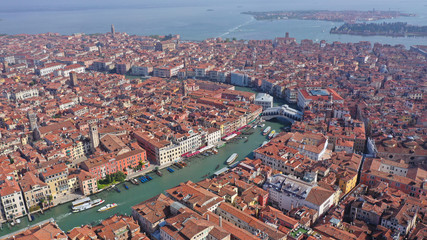 Aerial drone panoramic photo of iconic and unique Grand Canal crossing city of Venice as seen from high altitude, Italy