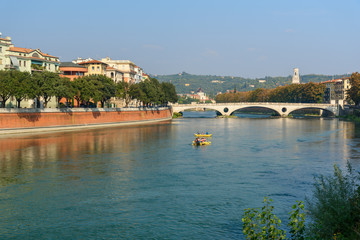 Fototapeta na wymiar View of Ponte della Vittoria or Victory Bridge over Adige River. Verona. Italy