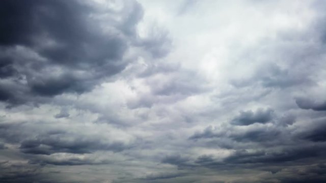 the emergence of new clouds in the overcast sky foreshadowing a storm and the rain. timelapse. Motionlapse.