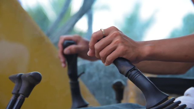 Excavator Operator hand closed shot other angle