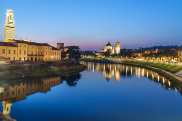 Fototapeta premium View from Ponte Pietra on Adige River and city at night. Verona. Italy
