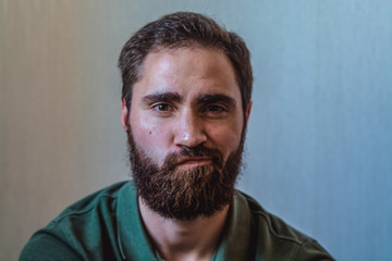 Various emotions on a face at the young bearded European man. Different mood.