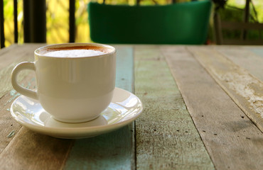 Cup of Cappuccino Coffee on Rustic Style Wooden Table 