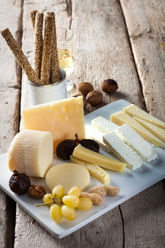 cheese plater with wine and bread sticks