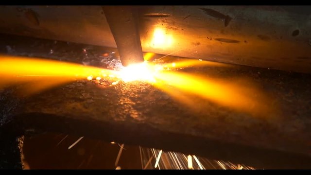 close up slow mo shots of cutting torch being used on an industrial level