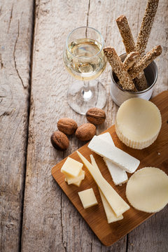 cheese plater with wine and bread sticks