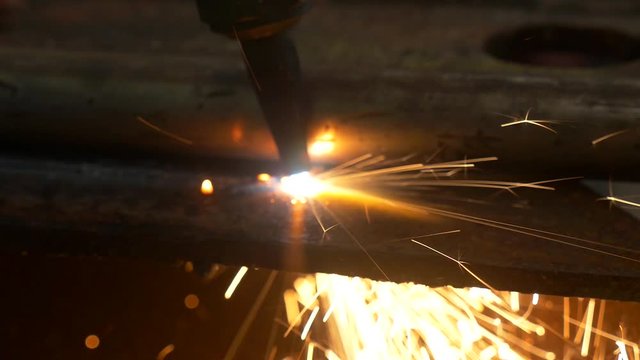 close up slow mo shots of cutting torch being used on an industrial level