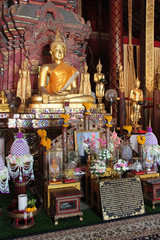 altar and statue of buddha in a buddhist temple (Wat Chiang Man) in chiang mai (thailand)