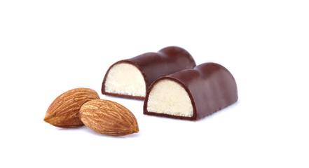 Closeup shot of cut marzipan chocolate on white background. Marzipan candy.