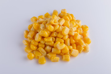 Canned corn on a white acrylic background