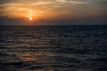Sunset above sea