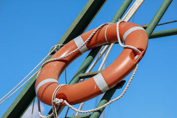 Red life buoy on the sea beach