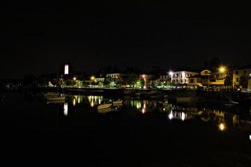 Obraz premium Night view of the village of Lesa overlooking Lake Maggiore, Piedmont, Italy