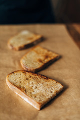 Toasted bread on parchment paper